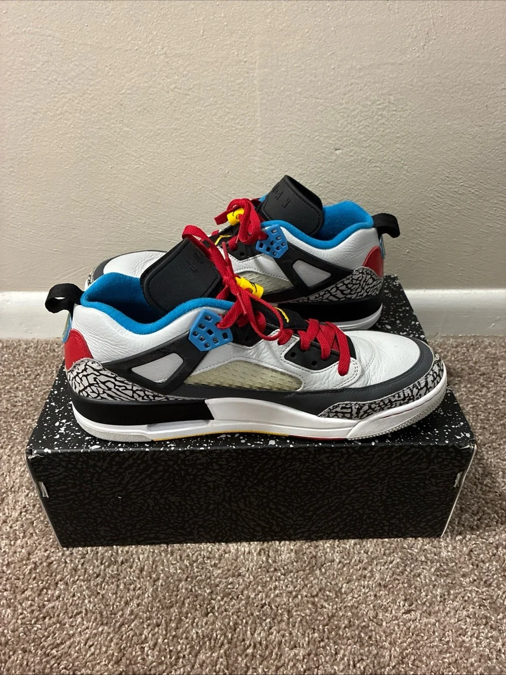 Jordan Men's White Athletic Shoes with Black, Red & Blue Accents